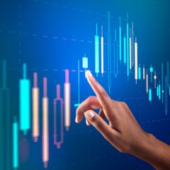 Stock market chart on virtual screen with woman’s hand digital remix